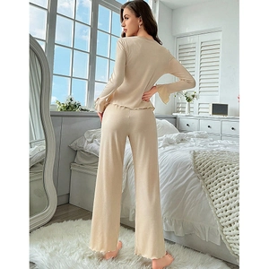 Beige two-piece loungewear set with ruffle cuffs and ribbed knit texture for women