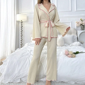 Women's cream white textured lounge set with pink wavy trim and tie-waist detail