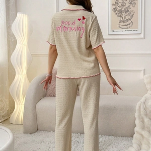 Women's seersucker pajama set with short-sleeve top and pants in cream white