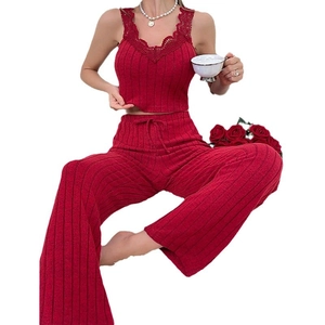Women's two-piece ribbed loungewear set with red lace camisole and wide-leg trousers
