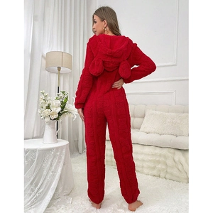Detail view of red fuzzy bear jumpsuit with thick plush texture and cute 3D ears