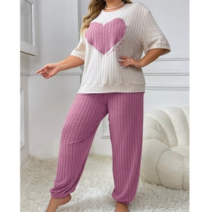 Women's plus size pajama set featuring heart print short sleeve top and pink lounge pants