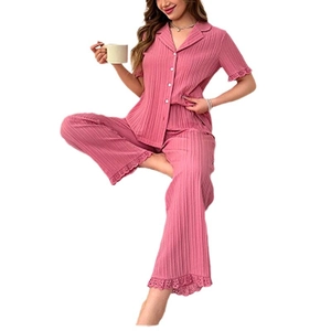 Pink rib-knit pajama set with short-sleeved button-down top and lace-trim wide-leg trousers