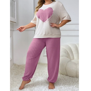 Women's pajama set with cream love you top and pink ribbed lounge pants in relaxed fit