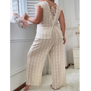 Elegant two-piece white lace loungewear set with open back tie design and wide leg pants