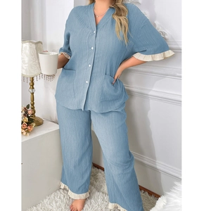 Detail of light blue pajama set with V-neck cardigan and beige ruffled lace trim
