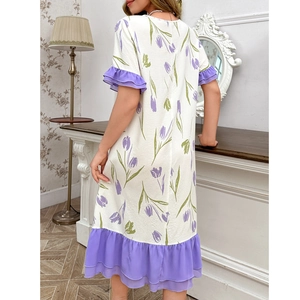 Detail of tulip print homewear dress with lilac ruffle hem and textured fabric