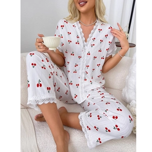Women's white waffle knit cherry print pajama set with V-neck lace trim and long pants