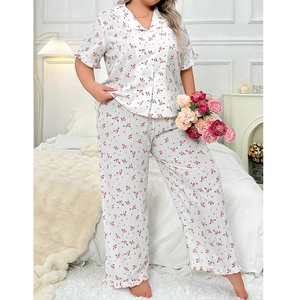 Floral print pajama set with short sleeve lapel shirt and trousers in cozy bedroom setting