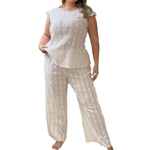 Lace hollow two-piece loungewear set for women featuring short sleeve top and wide leg pants