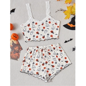 Detail of Halloween pajama set with lace straps, pumpkin and ghost prints on ribbed fabric