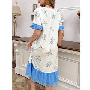 Detail view of floral loungewear dress featuring ruffled blue hem and soft chiffon fabric
