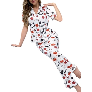 Women's Halloween pajama set with pumpkin and bat prints featuring lettuce edge trim