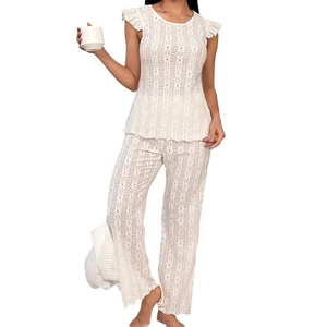 Women's white two-piece loungewear set with eyelet embroidery and ruffled sleeves