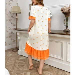 Detail of short sleeves with ruffles and floral print on a summer nightdress