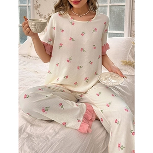 Women's floral pajama set with ruffled sleeves and tulip print in creamy white