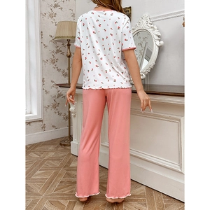 Floral short sleeve top and pink trousers pajama set for girls with ruffled hem detailing