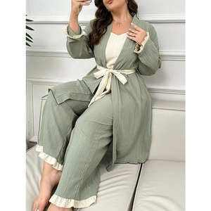 Three-piece women's lounge set in sage green with ruffled trim and textured fabric