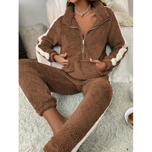 Women's warm brown sherpa loungewear set with half-zip top and striped trousers