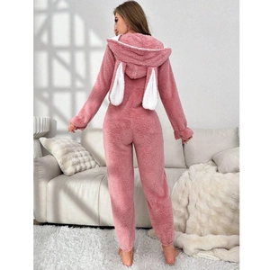 Detail of pink coral fleece jumpsuit with bunny ears hood and soft plush texture