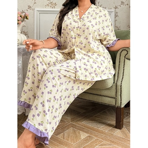 Detail of V-neck pajamas with purple tulip floral print and delicate ruffled cuffs