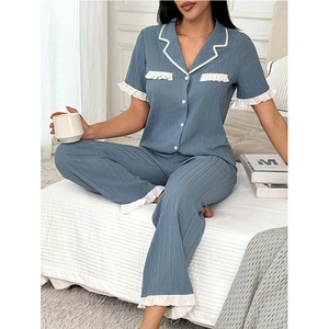 Short-sleeve pajama set for women in dusty blue with white ruffled trim and lounge pants