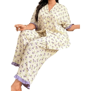 Women's plus size pajama set featuring purple tulip print and ruffled trim on cream fabric