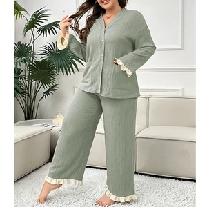 Detail of plus size sage green pajama set with delicate lace ruffle trim and V-neckline
