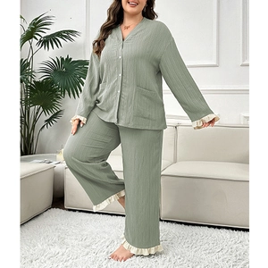 Women's plus size V-neck pajama set in sage green with ruffled lace trim and button-up top