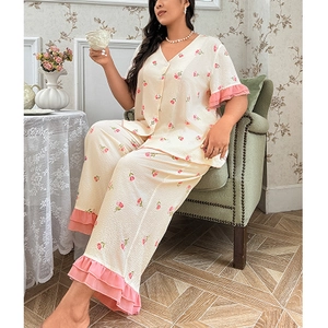 Women's plus size floral pajama set with V-neck top and ruffled trousers in beige and pink