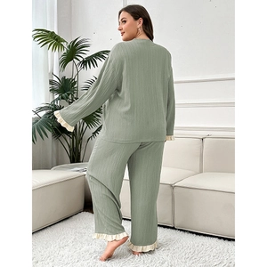 Sage green two-piece loungewear set featuring ruffle trim and textured crepe fabric