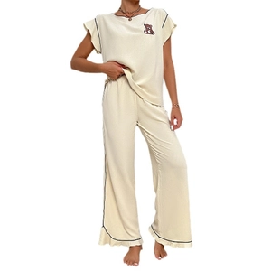 Women's cute bear pajama set featuring round neck short sleeve top and long pants in beige