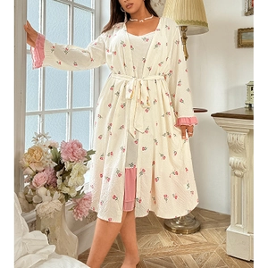 Detailed view of floral ruffle trim and waffle texture on three-piece pajama set