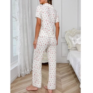 Women's two-piece pajama set featuring cherry floral print and white lace trim