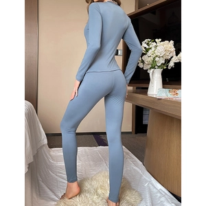 Slim fit V-neck thermal pajama set in dusty blue with long sleeves and elastic leggings