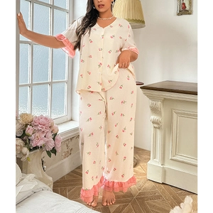 Detail of floral V-neck pajama set with pink ruffle trims and soft waffle texture