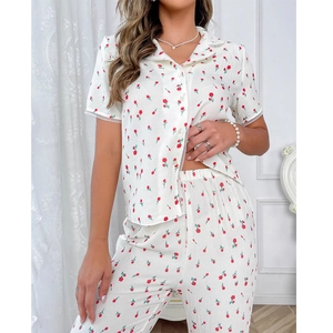 Women's pajama set featuring short sleeve button shirt and long pants with red floral print