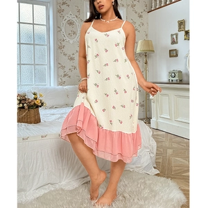 Detailed view of floral plus size nightgown with pink lace trim and double ruffles
