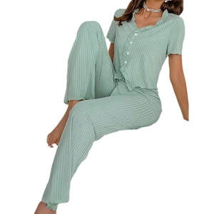 Women's V-neck green pleated pajama set featuring ruffled edges and a button-up cardigan