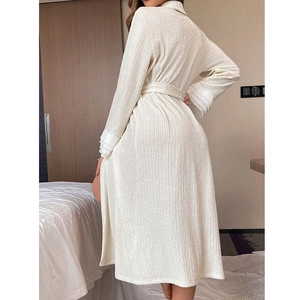 Elegant cream-white textured long-sleeve bathrobe with belt and tiered cuff details