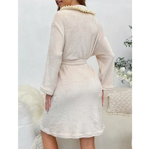 Cozy cream fleece bathrobe for women with oversized ruffle collar and matching waist belt