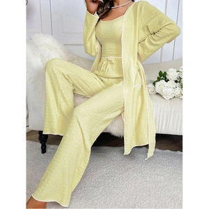 Detailed view of the pleated fabric texture and design on the pale yellow loungewear set