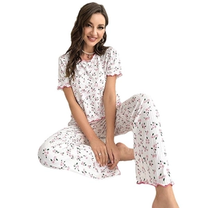 Women's two-piece floral pajama set with short-sleeved top and pants in white and pink