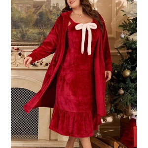 Detail of red fleece pajama set featuring a white fluffy bow and ruffled hem for winter