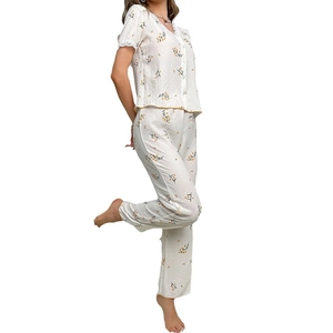 Women's two-piece white V-neck lace floral pajama set with short sleeves and long pants