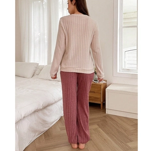 Two-piece ribbed pajama set with long sleeves and wide-leg pants in heart color block style
