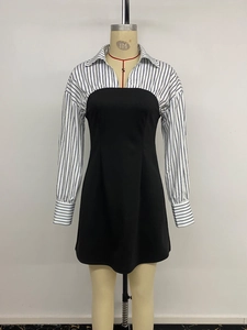 Detail of elegant faux two-piece dress with striped shirt collar and black mini skirt