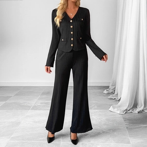 Elegant black two-piece knit set with textured V-neck jacket and wide-leg trousers