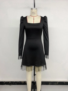 Detail of square neck dress with bubble sleeves and sheer mesh trim at the hem and cuffs