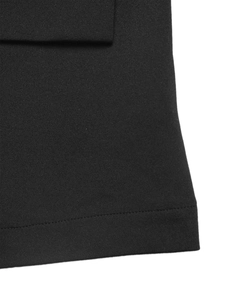 Detail view of high-density black woven fabric with precise stitching and elegant drape